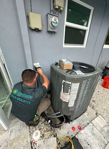 Comfactor Air technician working on a package HVAC unit